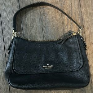 kate spade Satchel with front pocket and 3 interior pockets. Black Leather. NWOT